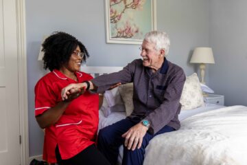 ECL customer and Community Care Assistant doing exercises