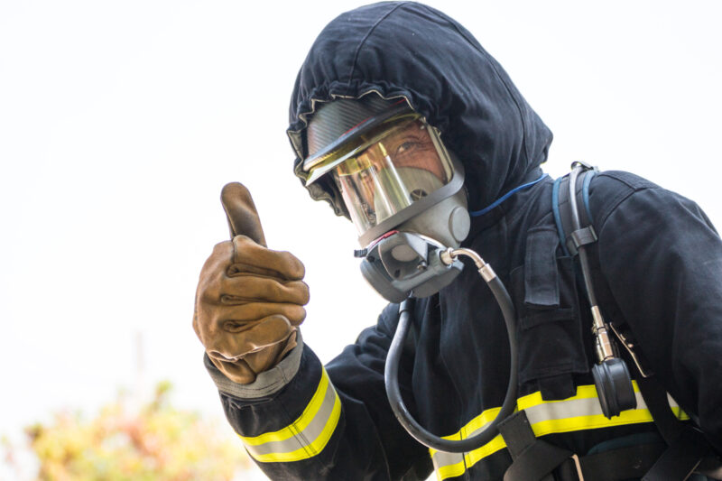 Fireman putting his thumb up.