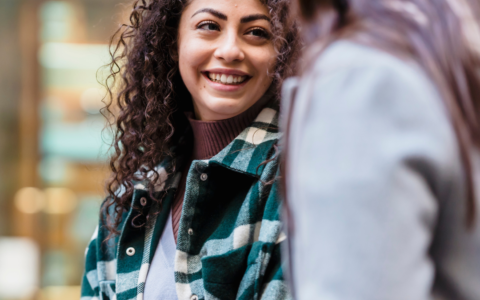 A woman smiling.